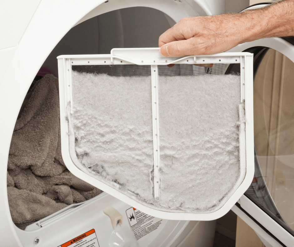 Person cleaning out dryer lint